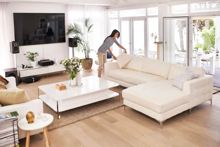 Luxury homeowner preparing a premium residence for resale with a real estate advisor